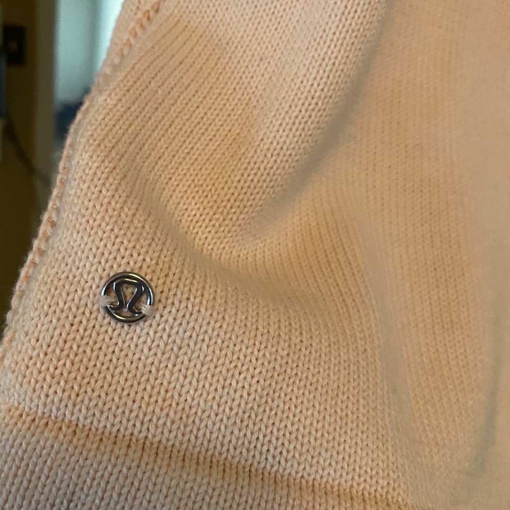 Lululemon short sleeve light pink sweater. Size 8.